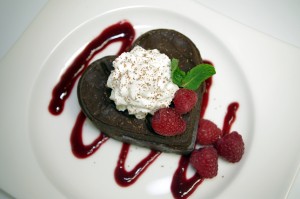 Valentine Chocolate Mousse Cake With Raspberry Sauce Plated